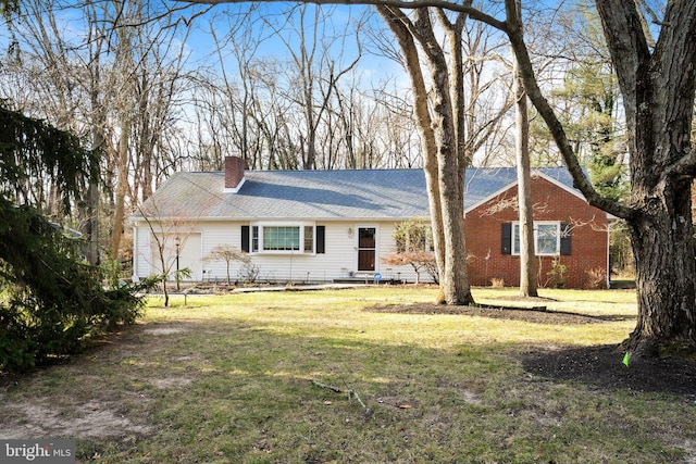 single story home featuring a front yard and a garage