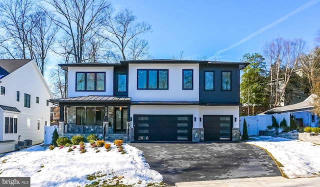 view of front of house with a garage and covered porch