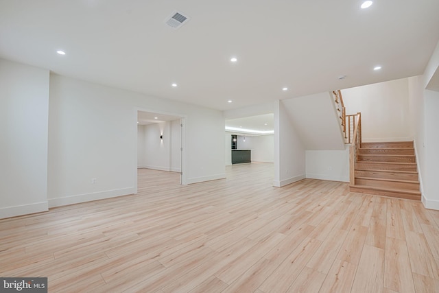 unfurnished living room with light wood-type flooring