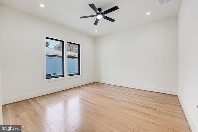 spare room featuring ceiling fan and light hardwood / wood-style floors