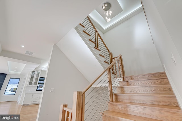 stairs featuring wood-type flooring