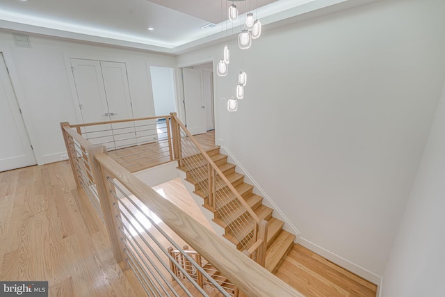 stairway featuring hardwood / wood-style flooring