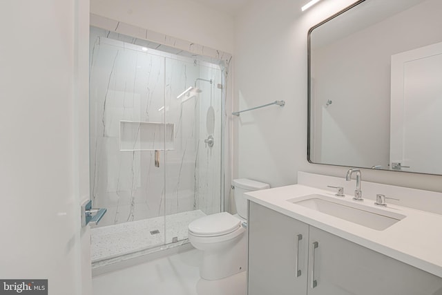 bathroom with vanity, toilet, and walk in shower