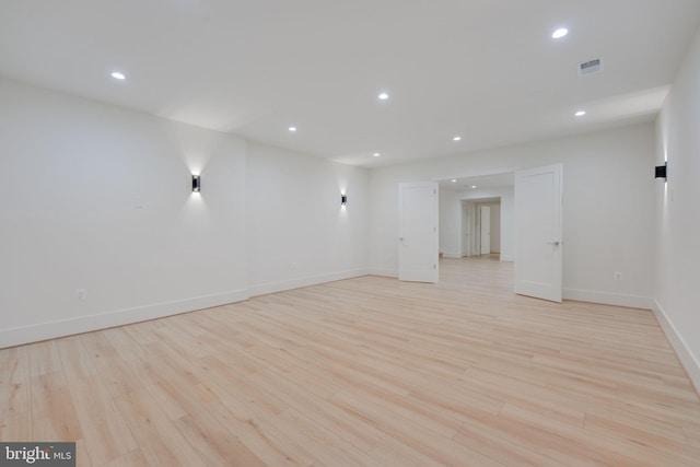 spare room featuring light wood-type flooring