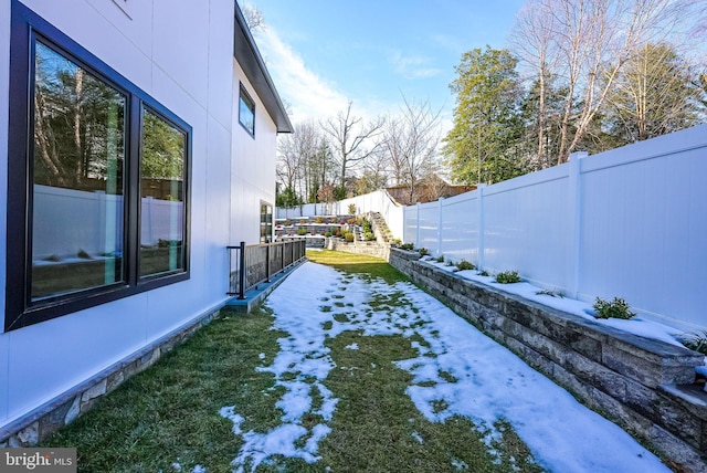 view of yard covered in snow