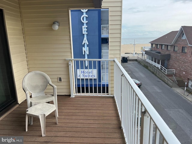 balcony featuring a water view