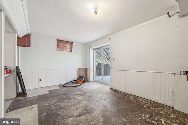 unfurnished room with concrete floors