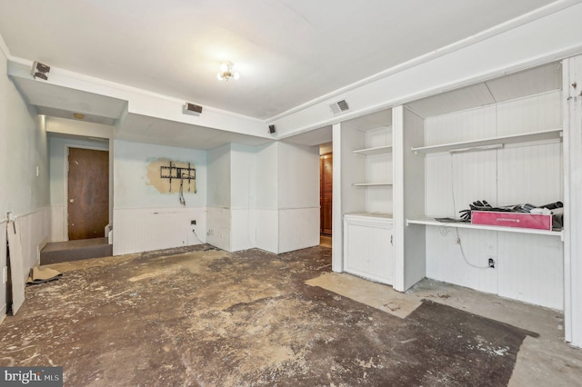 unfurnished room featuring concrete floors