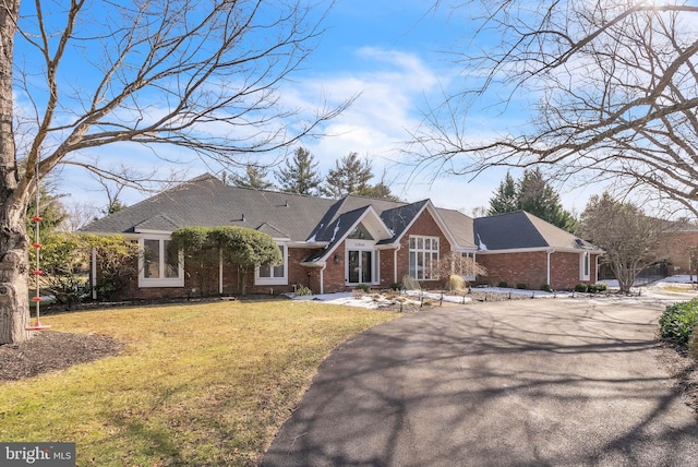 ranch-style house with a front yard