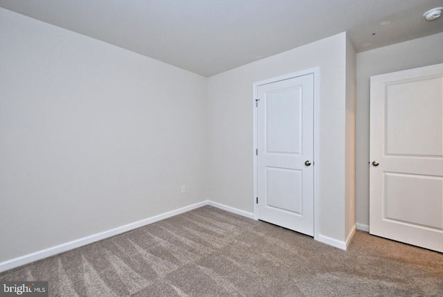 spare room with light carpet