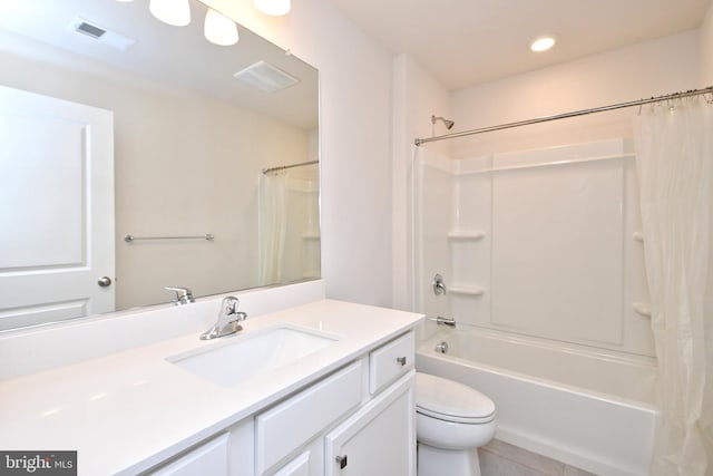 full bathroom with tile patterned floors, shower / bathtub combination with curtain, vanity, and toilet