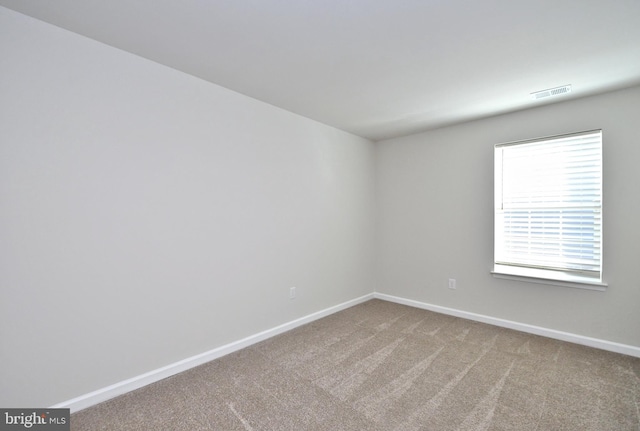 spare room with carpet flooring