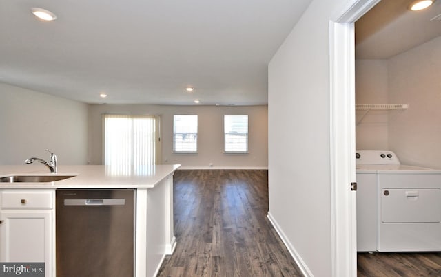 kitchen featuring white cabinets, stainless steel dishwasher, dark wood-type flooring, and sink