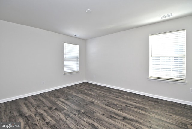 empty room featuring dark wood-type flooring