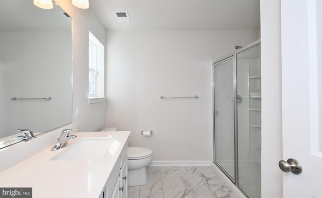 bathroom with walk in shower, vanity, and toilet