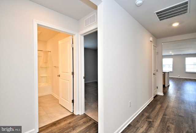 hall featuring wood-type flooring