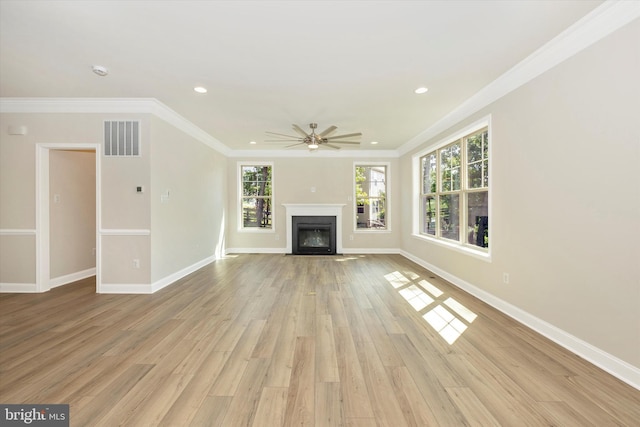 unfurnished living room with ceiling fan, crown molding, and light hardwood / wood-style flooring