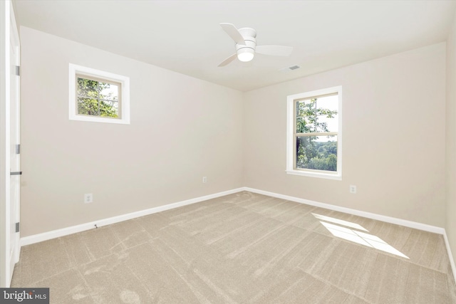 empty room with light carpet and ceiling fan