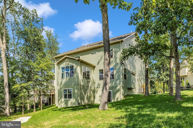 view of side of property with a lawn