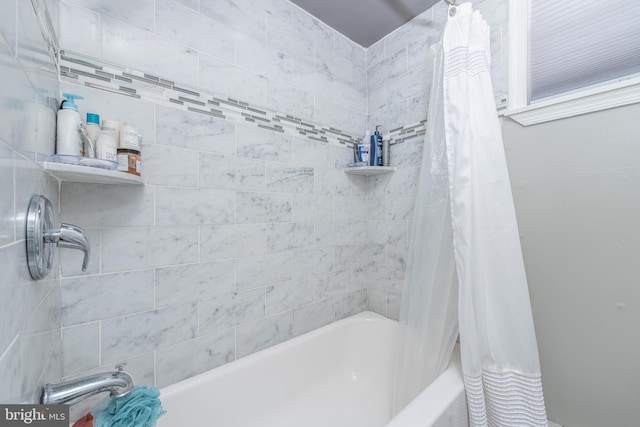 bathroom featuring shower / bath combination with curtain