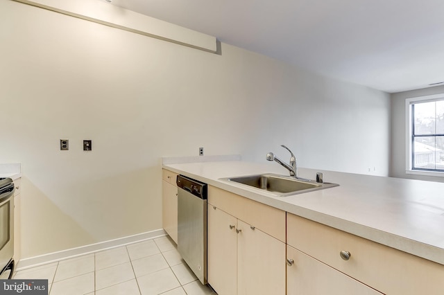 kitchen with stainless steel dishwasher, light tile patterned floors, and sink