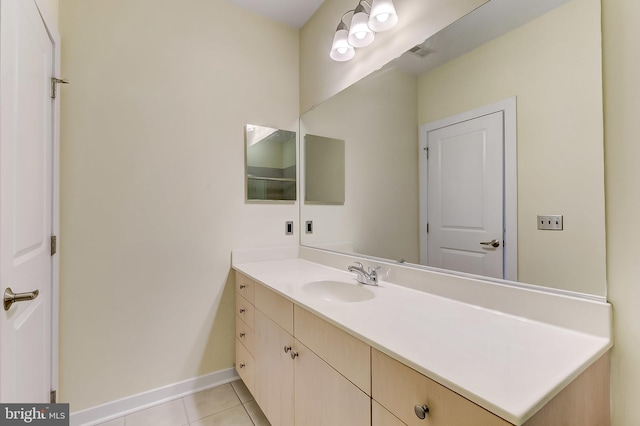 bathroom featuring tile patterned flooring and vanity