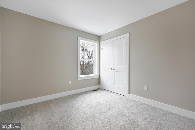 unfurnished bedroom with light carpet