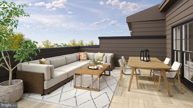 balcony featuring outdoor dining area and an outdoor living space