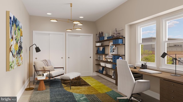 home office featuring light wood-style floors, recessed lighting, built in study area, and baseboards