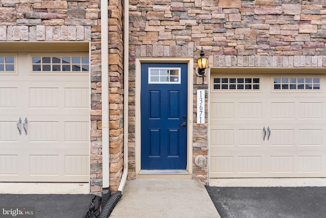 view of exterior entry with stone siding