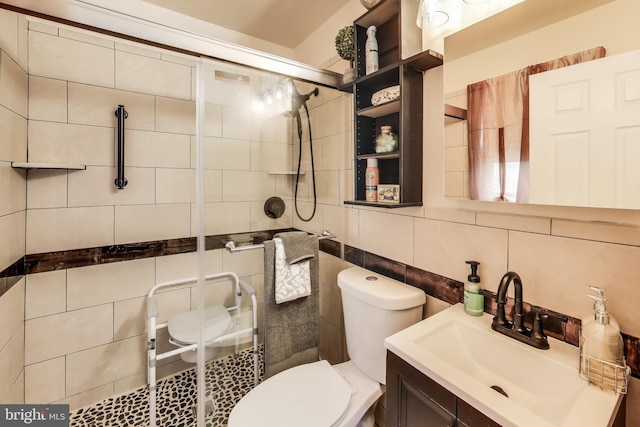 bathroom with a shower with door, vanity, tasteful backsplash, tile walls, and toilet