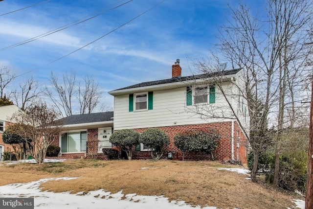 view of front of home with a yard