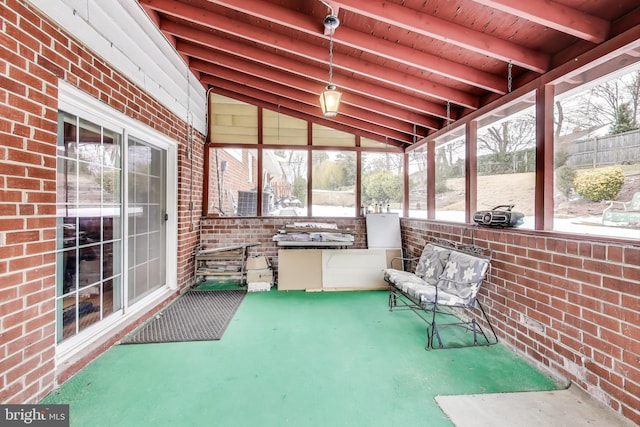 sunroom / solarium featuring wooden ceiling and lofted ceiling with beams