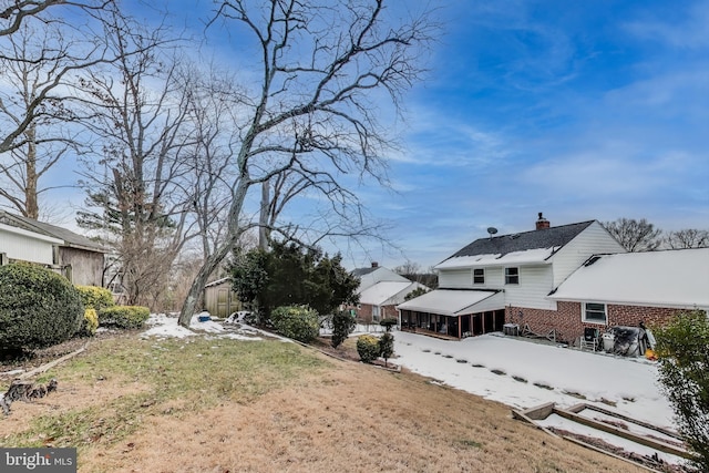 view of yard covered in snow