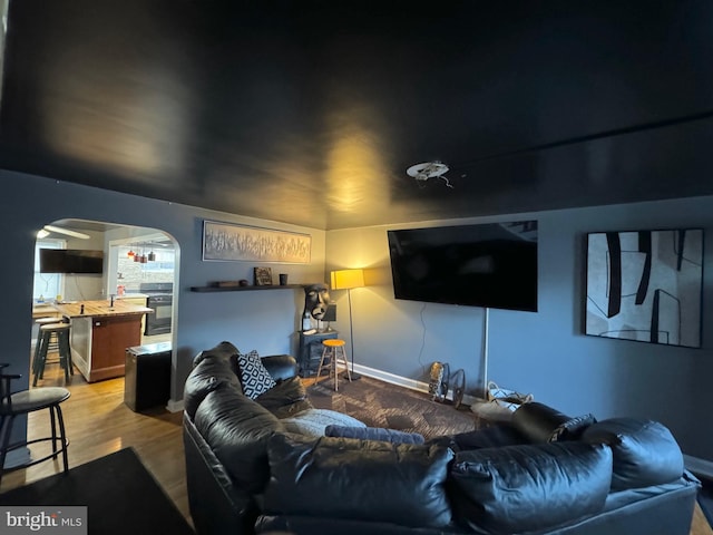 home theater featuring hardwood / wood-style flooring