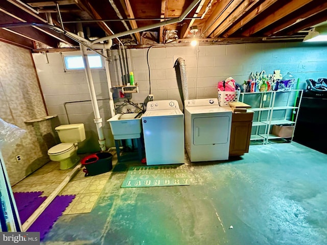 laundry room with washing machine and dryer and sink