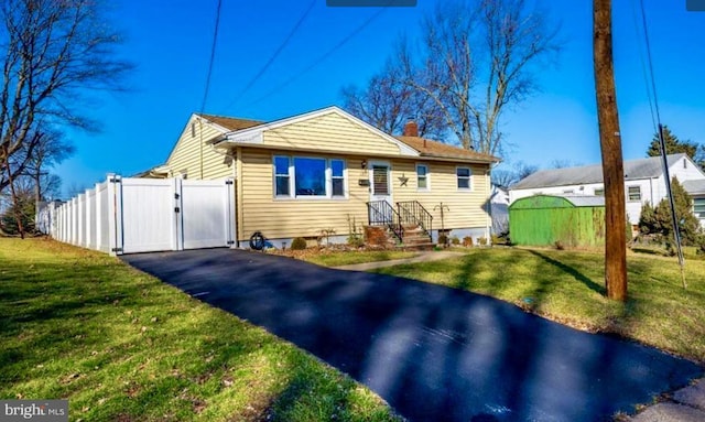 bungalow-style house with a front yard