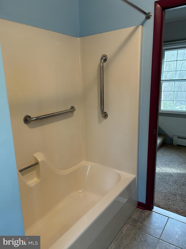 bathroom with baseboard heating and walk in shower