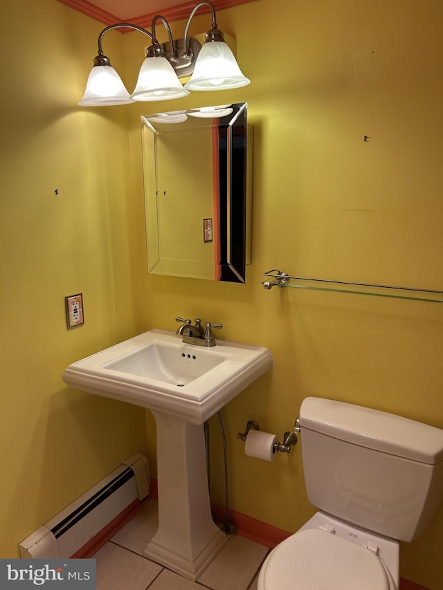 bathroom featuring tile patterned floors, toilet, and baseboard heating