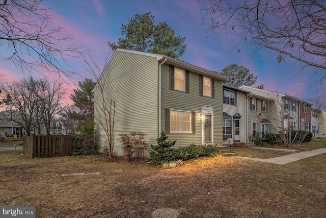 view of front of house with a yard