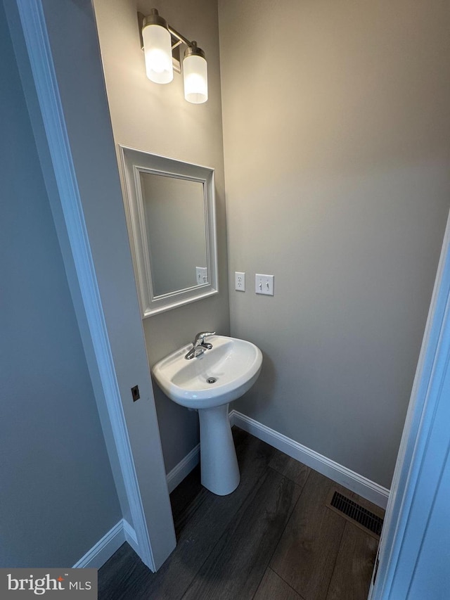 bathroom featuring wood-type flooring