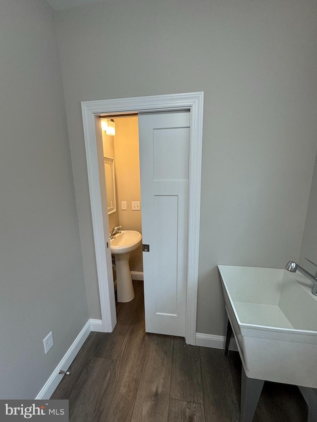 bathroom featuring sink and hardwood / wood-style floors