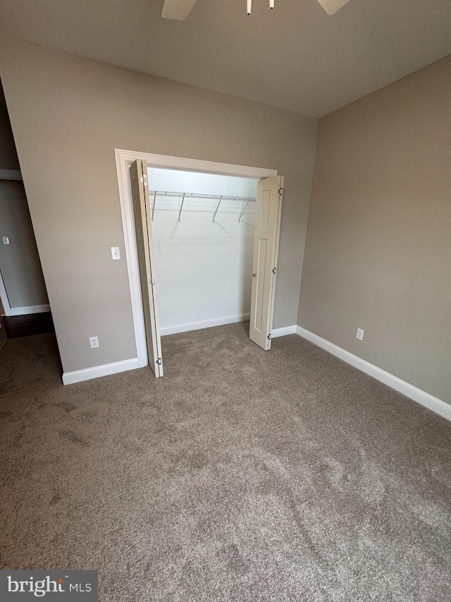 unfurnished bedroom with a closet and carpet