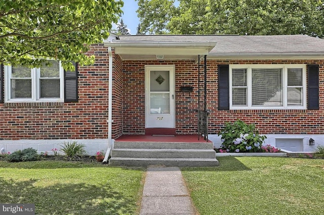 property entrance with a yard