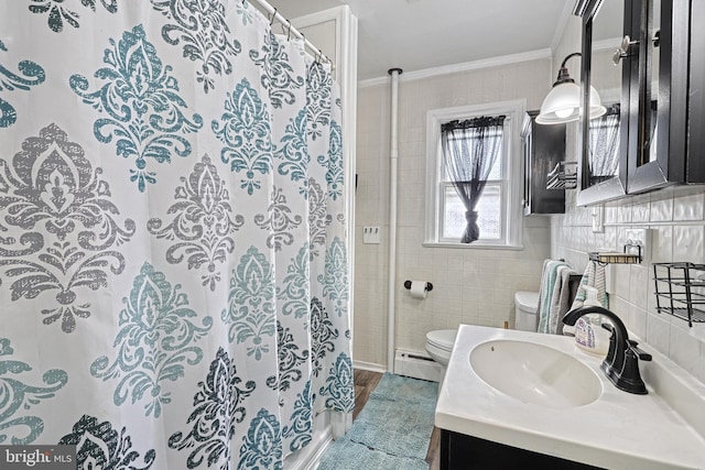 bathroom featuring vanity, backsplash, a baseboard heating unit, crown molding, and toilet