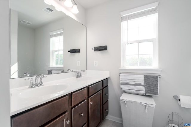 bathroom featuring vanity and a wealth of natural light