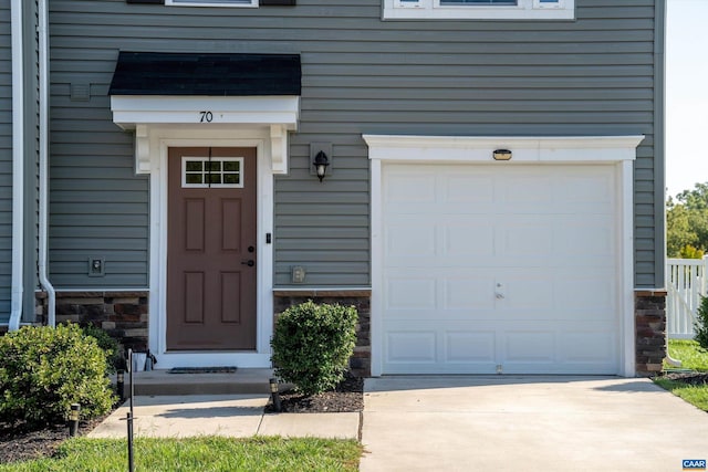 property entrance with a garage