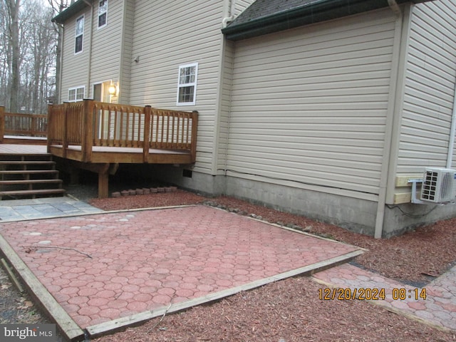 exterior space featuring a deck and a patio