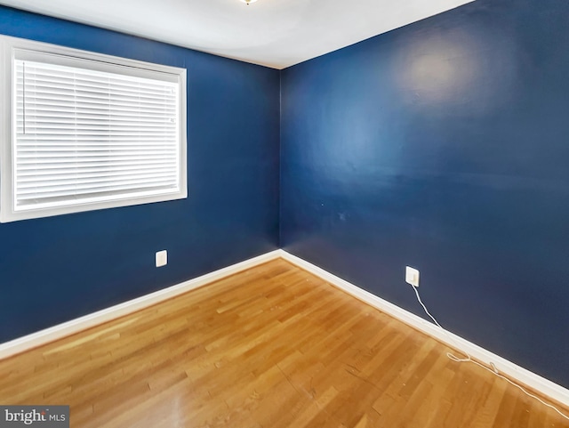 unfurnished room featuring hardwood / wood-style floors