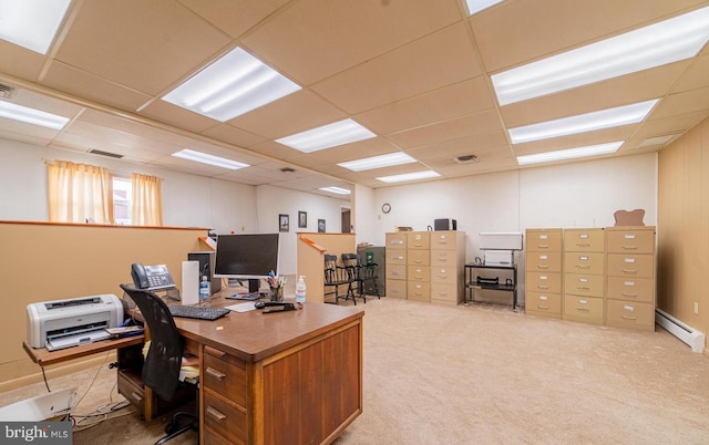 office featuring a drop ceiling, light carpet, and a baseboard radiator